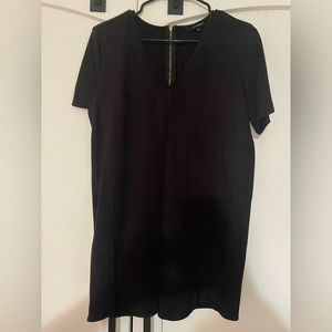 Short black dress with gold zipper on the back